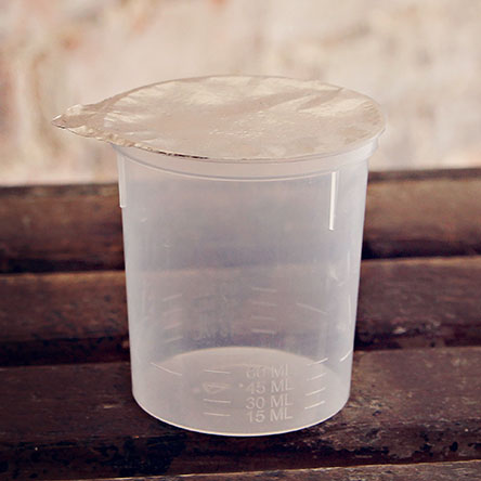Small plastic container with foil seal